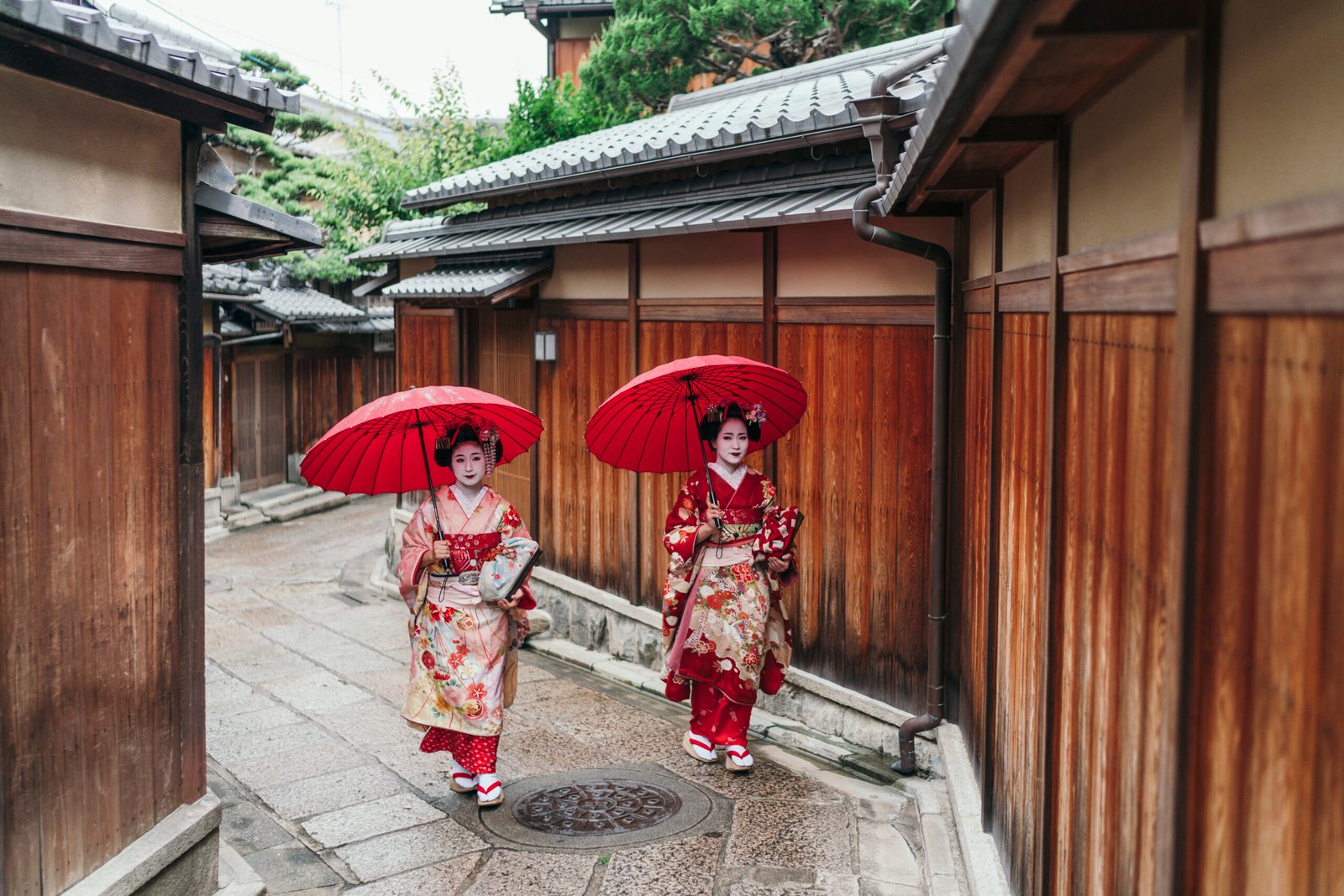 Maiko geisha walking on a street of Gion in Kyoto Japan